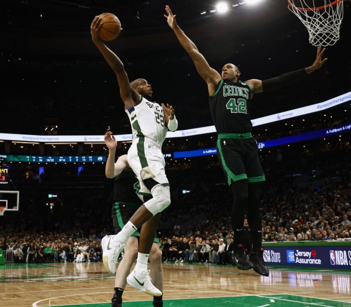 Boston Celtics center Al Horford (42) defends against Milwaukee Bucks forward Khris Middleton (22)